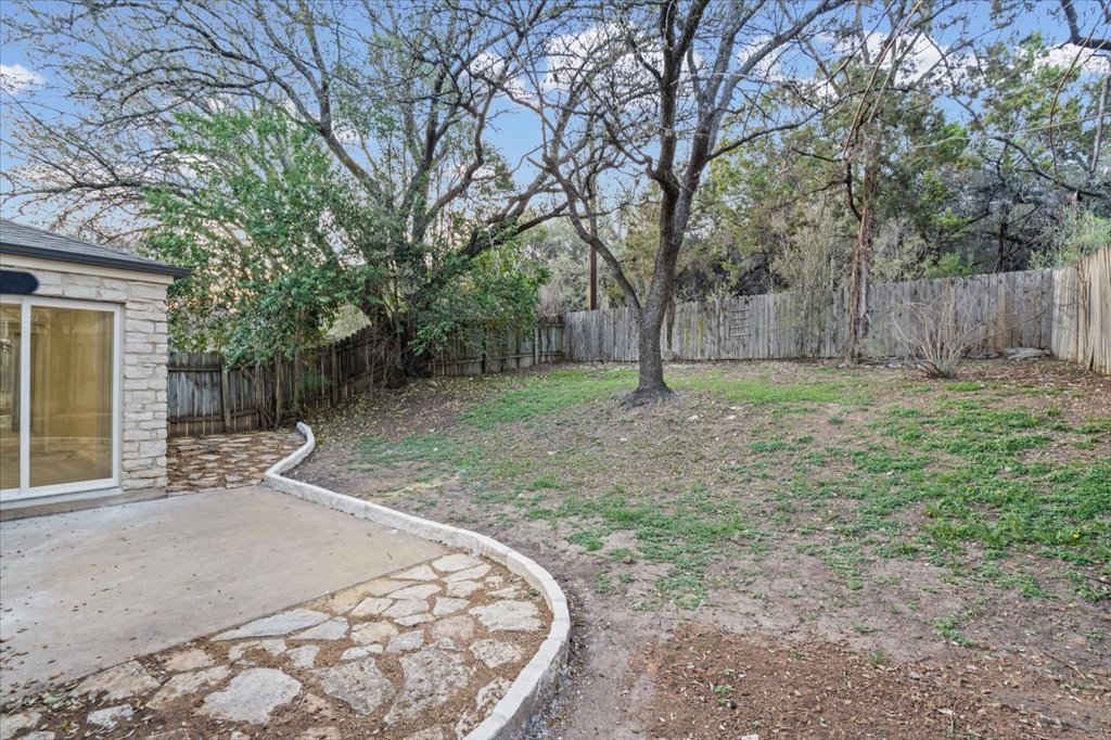 361 Fantail Loop, Unit B Austin, TX 78734 - Photo 25 of 29 a backyard of a house with lots of green space
