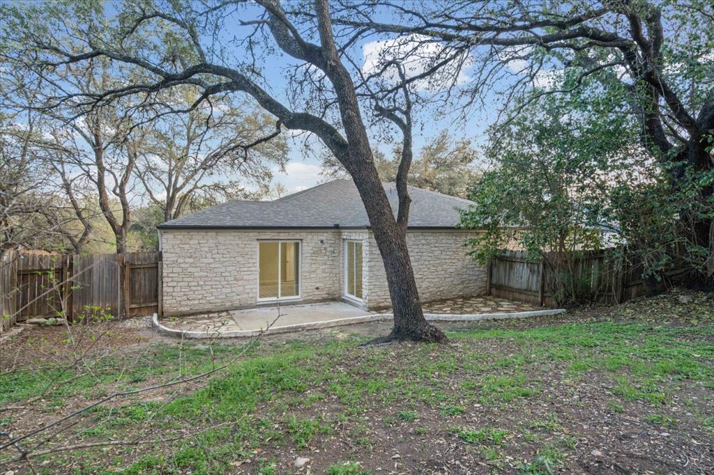 361 Fantail Loop, Unit B Austin, TX 78734 - Photo 27 of 29 a house that has a tree in front of the house