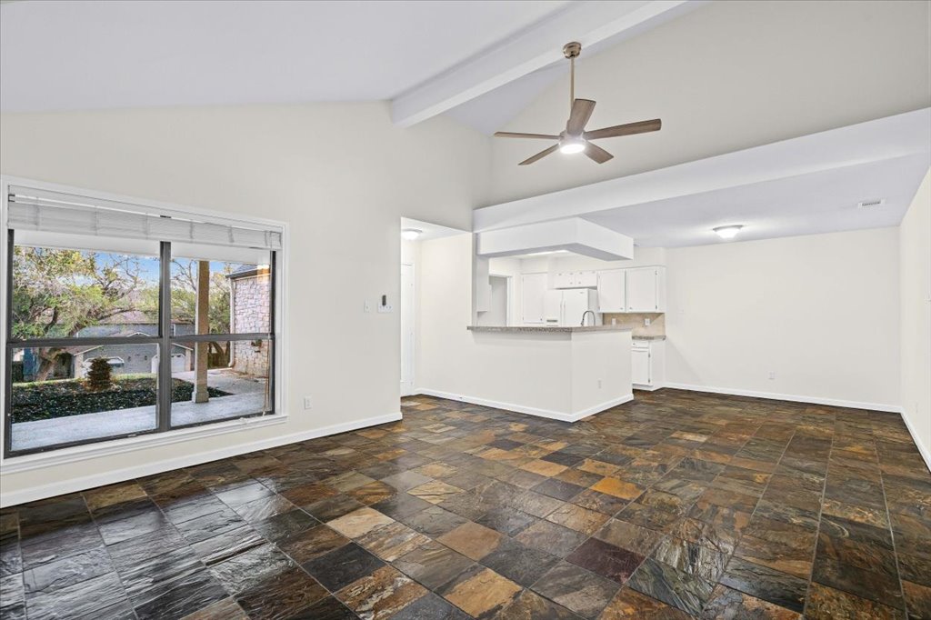 361 Fantail Loop, Unit B Austin, TX 78734 - Photo 8 of 29 a view of a kitchen with a sink and a window