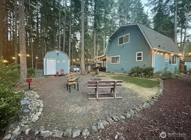 a backyard of a house with seating space