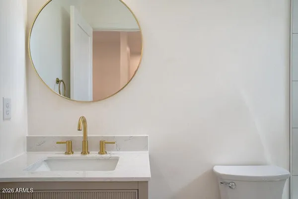 a bathroom with a toilet and a sink