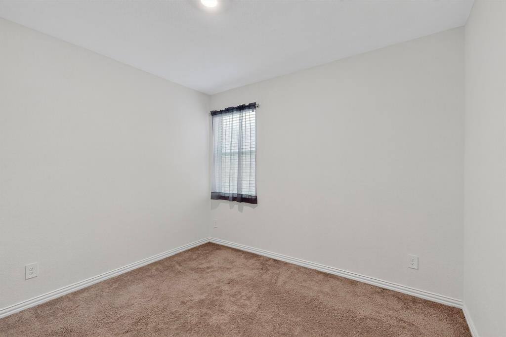 444 Ranchito Pass Fort Worth, TX 76052 - Photo 12 of 24 an empty room with windows