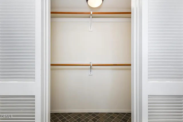 a view of a room with stairs and wooden floor