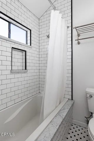 a view of a balcony with dining area