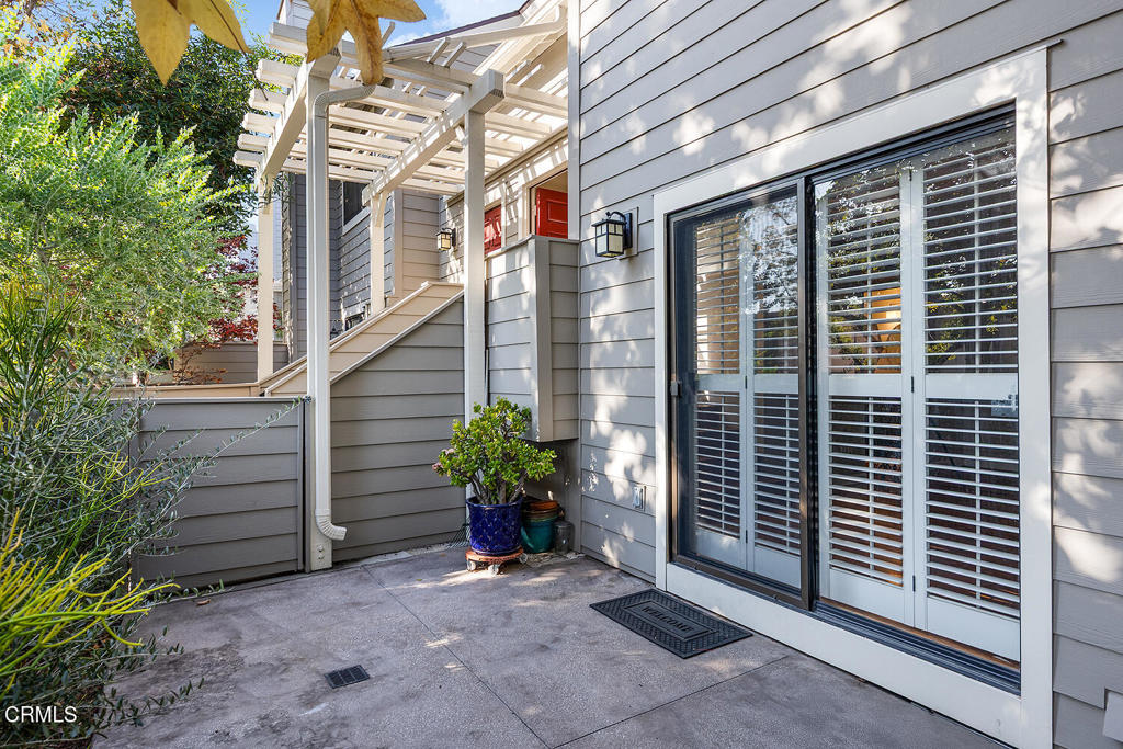 249 Alpine Street, Unit 44 Pasadena, CA 91106 - Photo 4 of 23 a view of a pathway of the house with potted plants