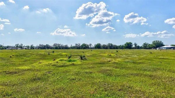 a view of a golf course with a lake