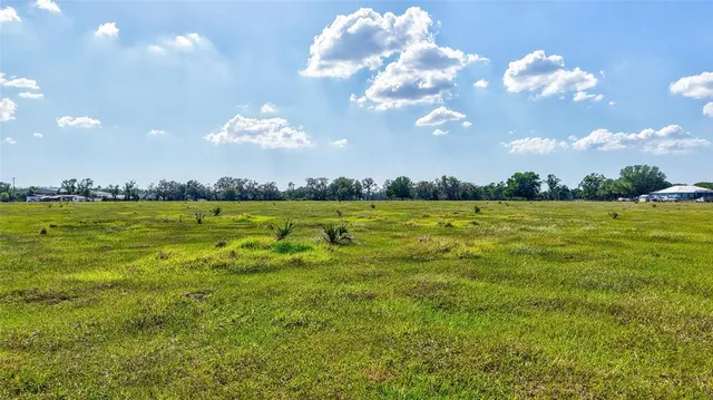 a view of a golf course with a lake