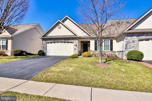 a front view of a house with yard
