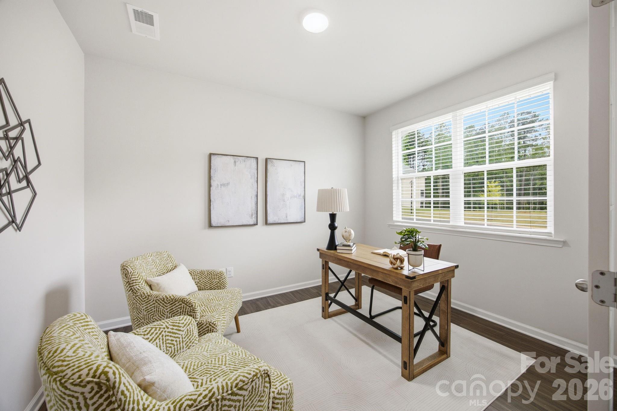 234 Hamptons Cove Road Troutman, NC 28166 - Photo 4 of 32 a living room with furniture and a window