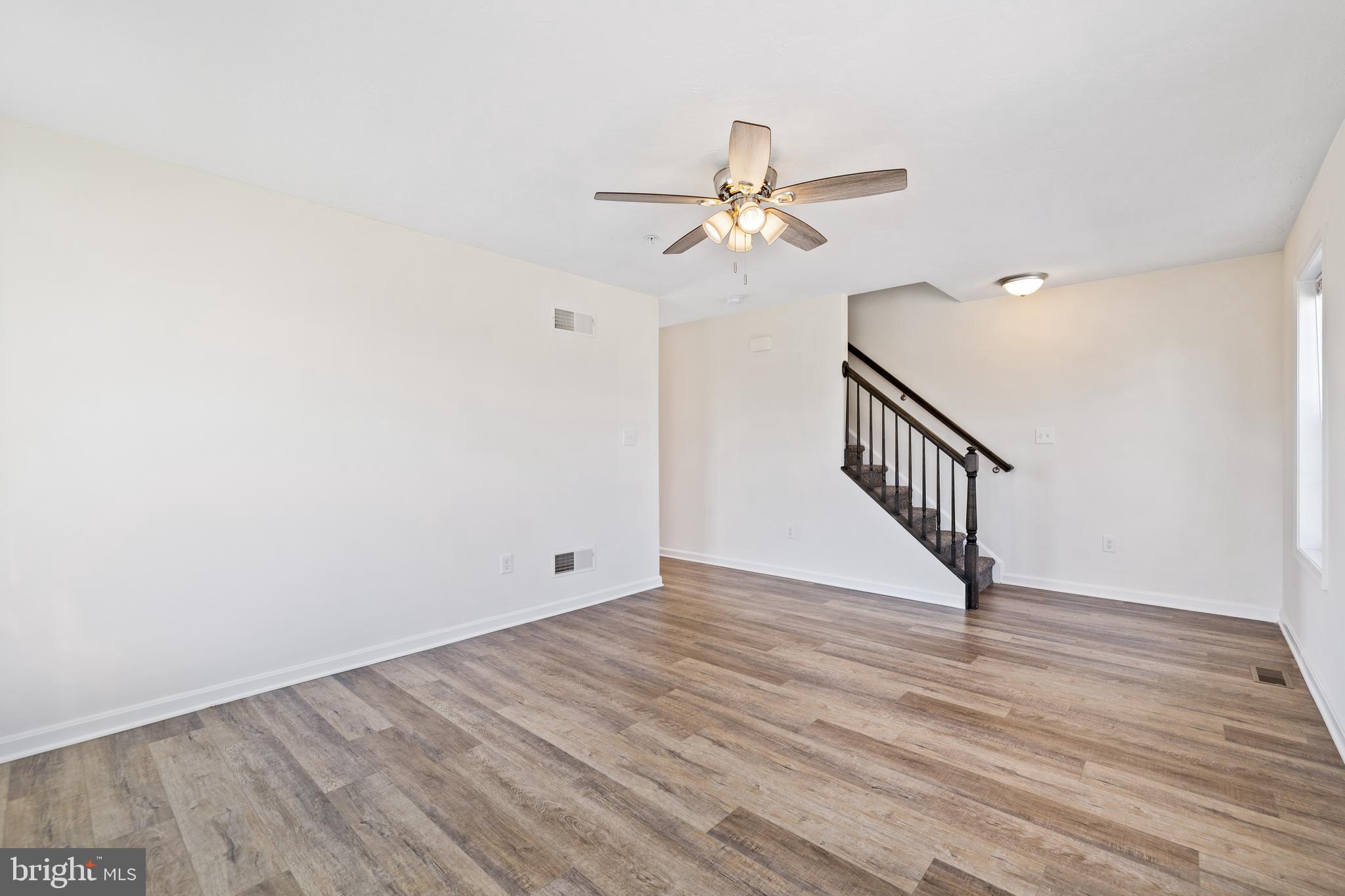 824 Rising Sun Lane Chambersburg, PA 17202 - Photo 10 of 25 a view of empty room with wooden floor and ceiling fan
