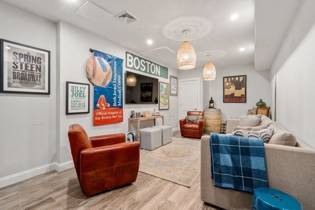 3 Colby Road Wellesley, MA 02482 - Photo 20 of 25 a living room with fireplace furniture and a flat screen tv