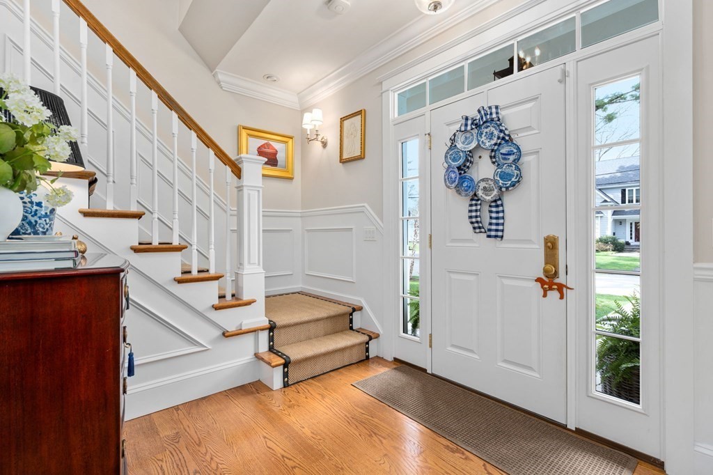 3 Colby Road Wellesley, MA 02482 - Photo 2 of 25 a view of entryway with wooden floor and stairs