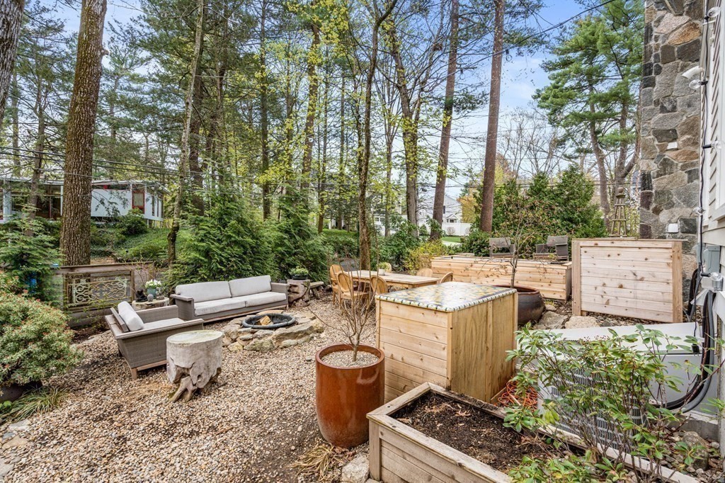 3 Colby Road Wellesley, MA 02482 - Photo 22 of 25 a view of a backyard with sitting area and garden