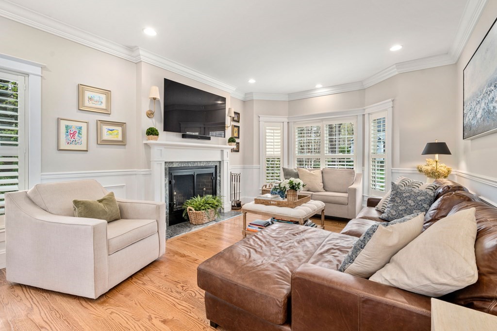 3 Colby Road Wellesley, MA 02482 - Photo 7 of 25 a living room with furniture a flat screen tv and a fireplace