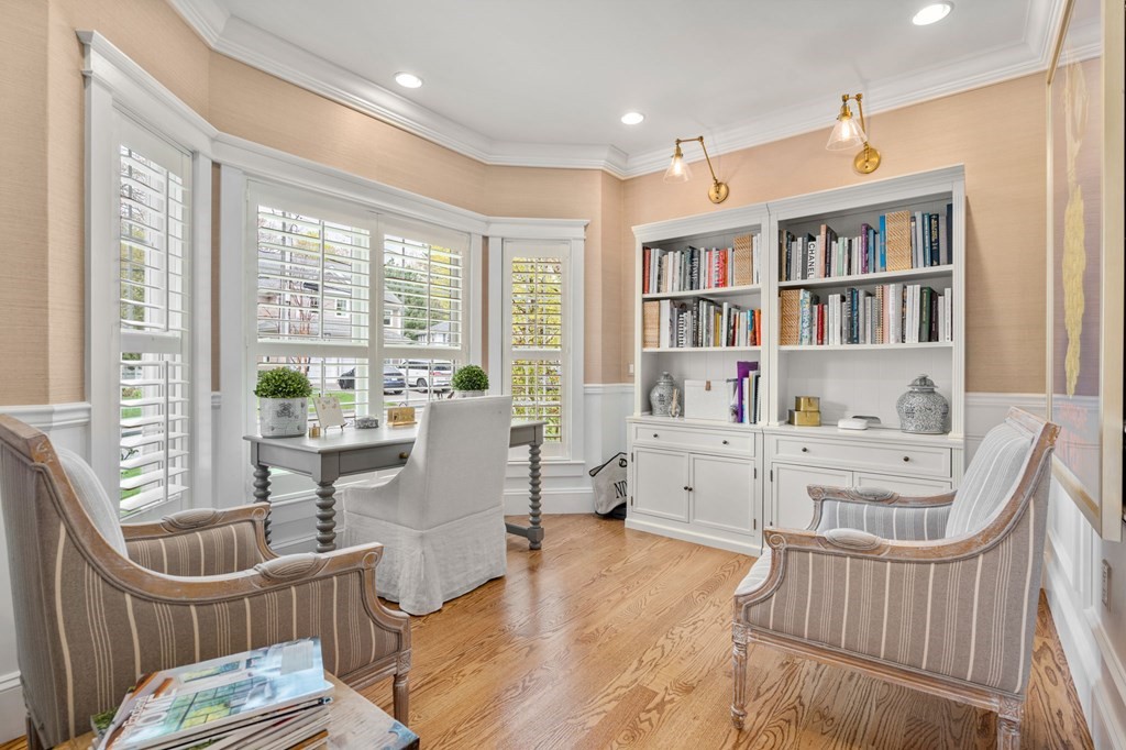 3 Colby Road Wellesley, MA 02482 - Photo 9 of 25 a living room with furniture a flat screen tv and a book shelf