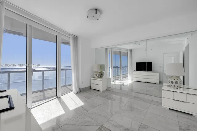 a living room with furniture and white walls