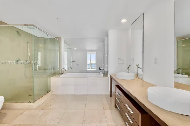 a hotel room with a television and a couch