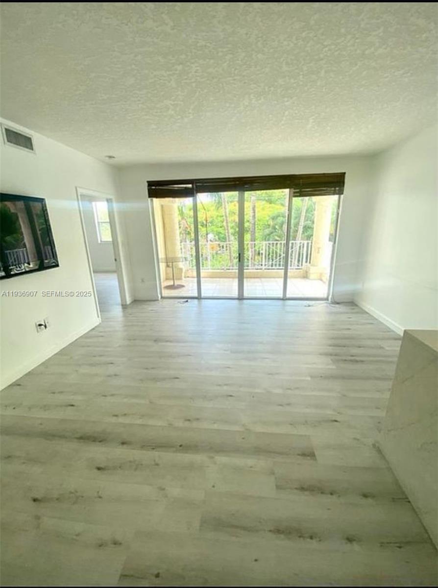 1824 Brickell Avenue, Unit 2B Miami, FL 33129 - Photo 13 of 13 a view of an empty room with a window