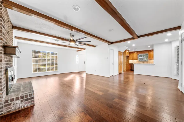 a view of an entryway with wooden floor
