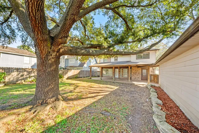 a view of house with yard