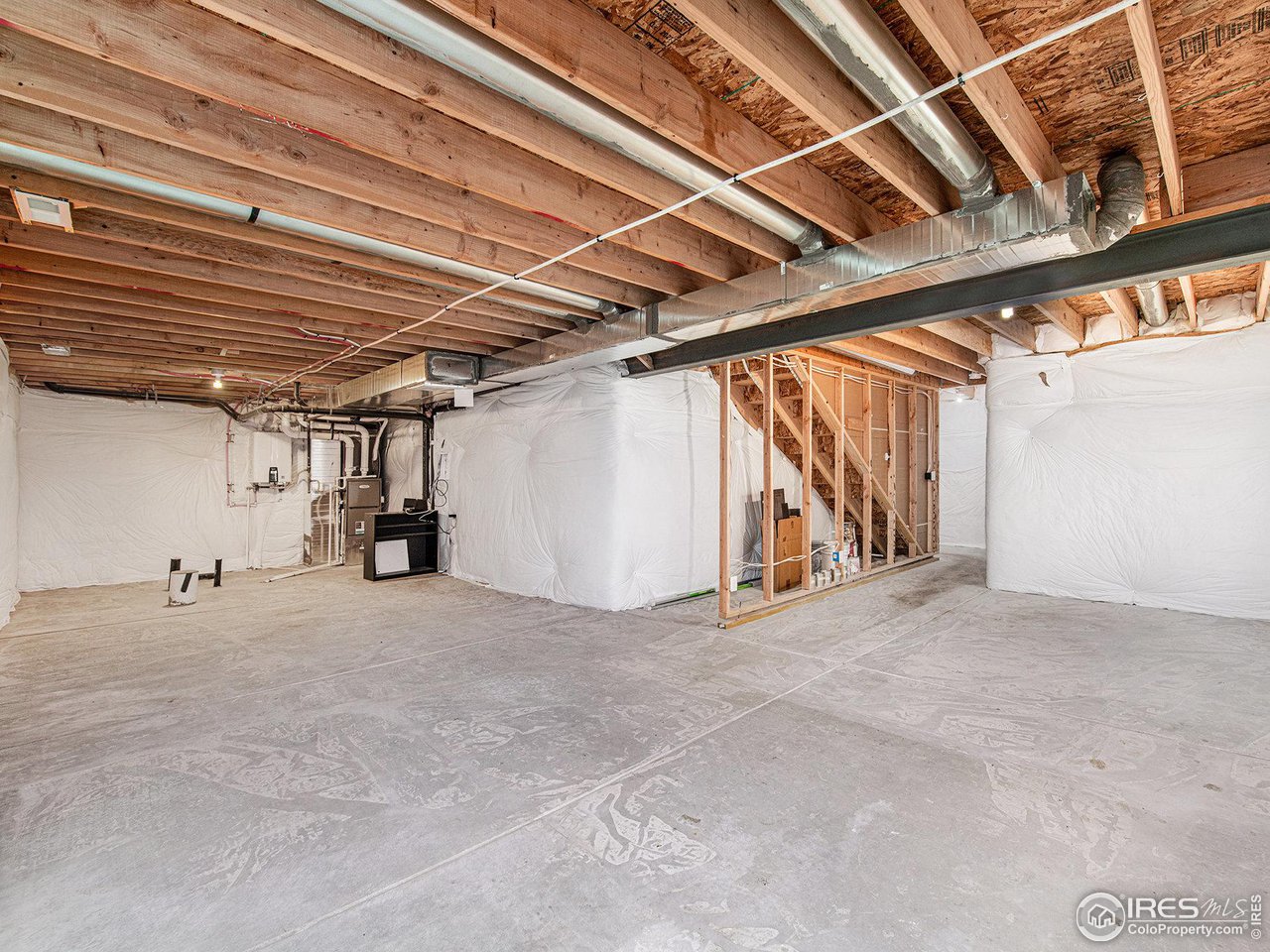 645 Apex Trail Ault, CO 80610 - Photo 29 of 39 Unfinished basement, with Bathroom Rough in