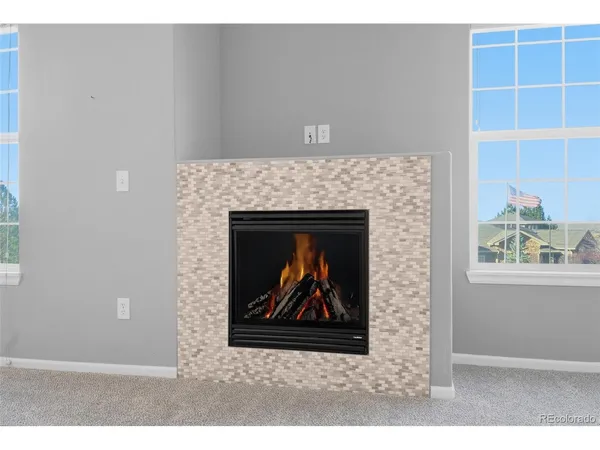 a stone house with a fireplace