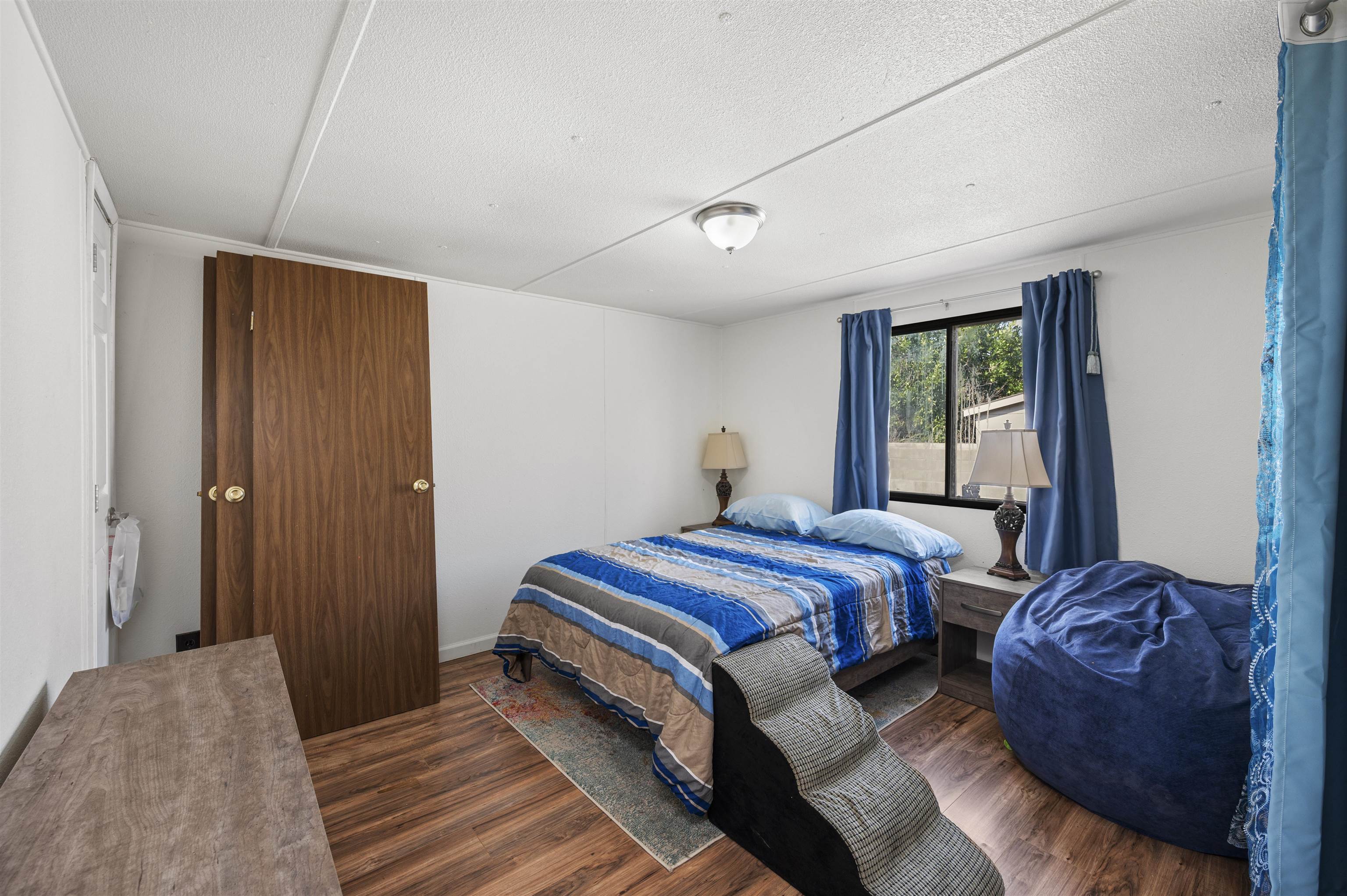 424 32 Road, Unit 6 Clifton, CO 81520 - Photo 13 of 16 a bedroom with a bed and a window