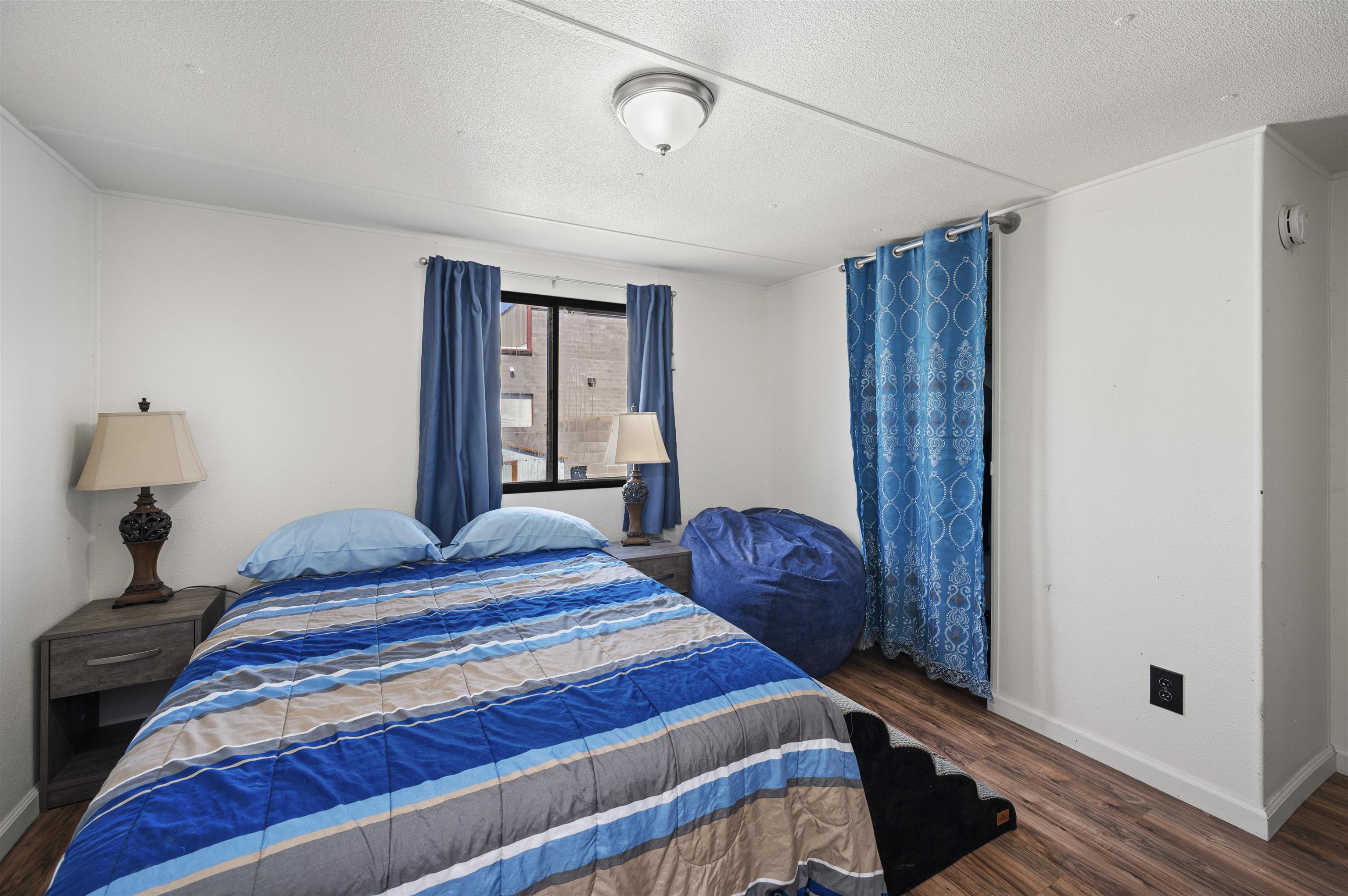 424 32 Road, Unit 6 Clifton, CO 81520 - Photo 14 of 16 a bedroom with a bed and a window