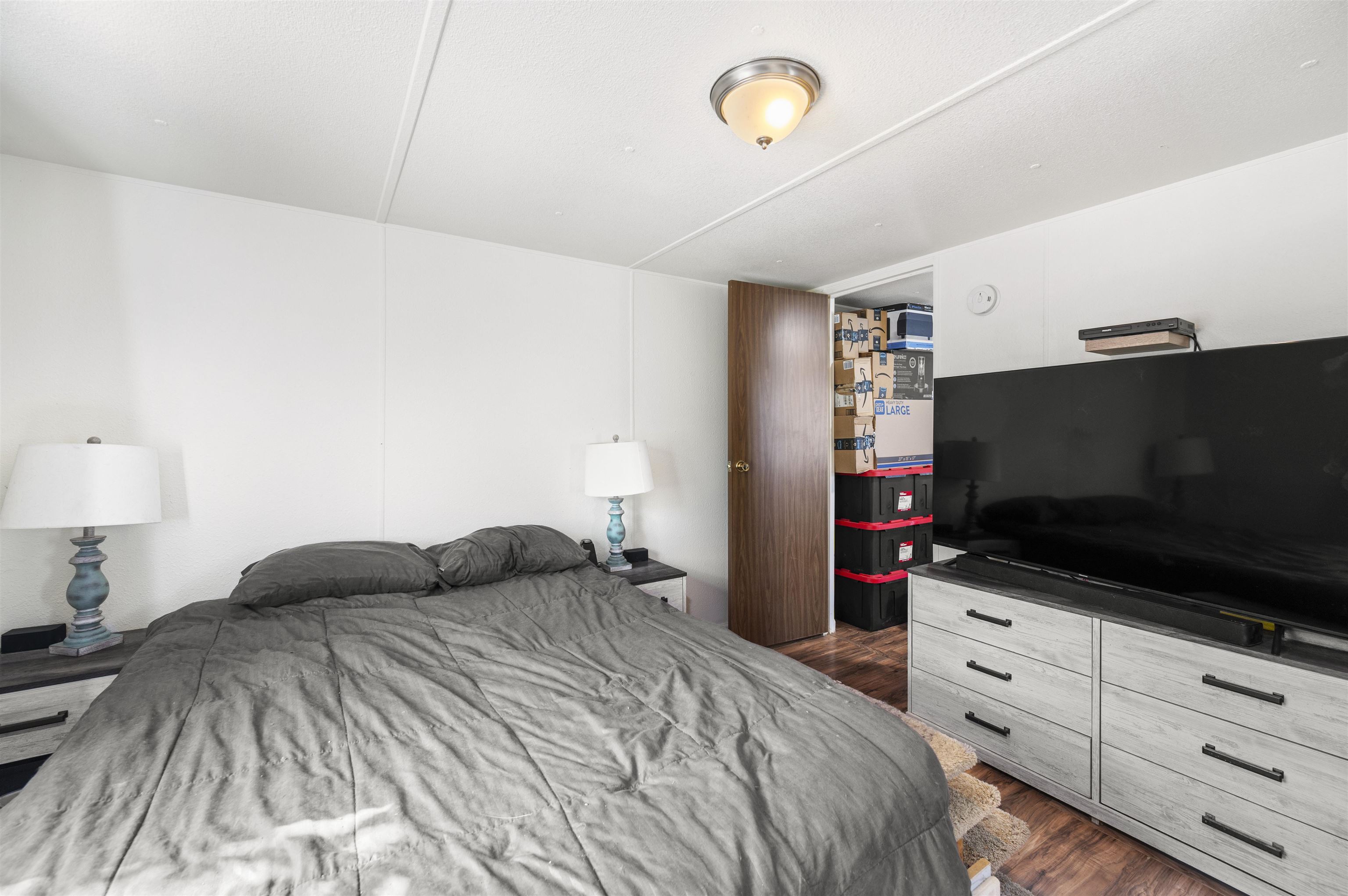 424 32 Road, Unit 6 Clifton, CO 81520 - Photo 16 of 16 a bedroom with a bed and a flat tv screen on dresser