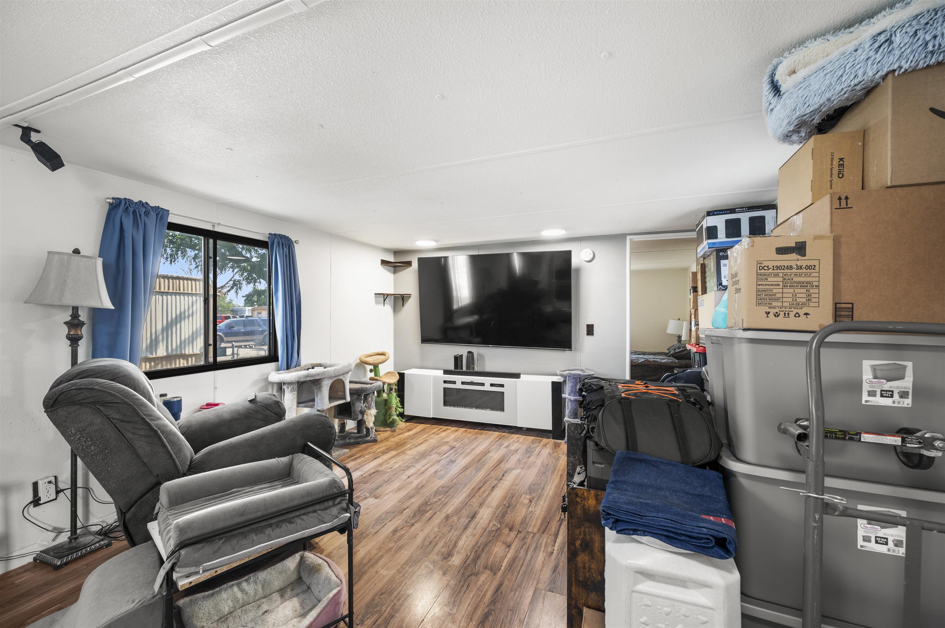 424 32 Road, Unit 6 Clifton, CO 81520 - Photo 5 of 16 a living room with furniture and a flat screen tv