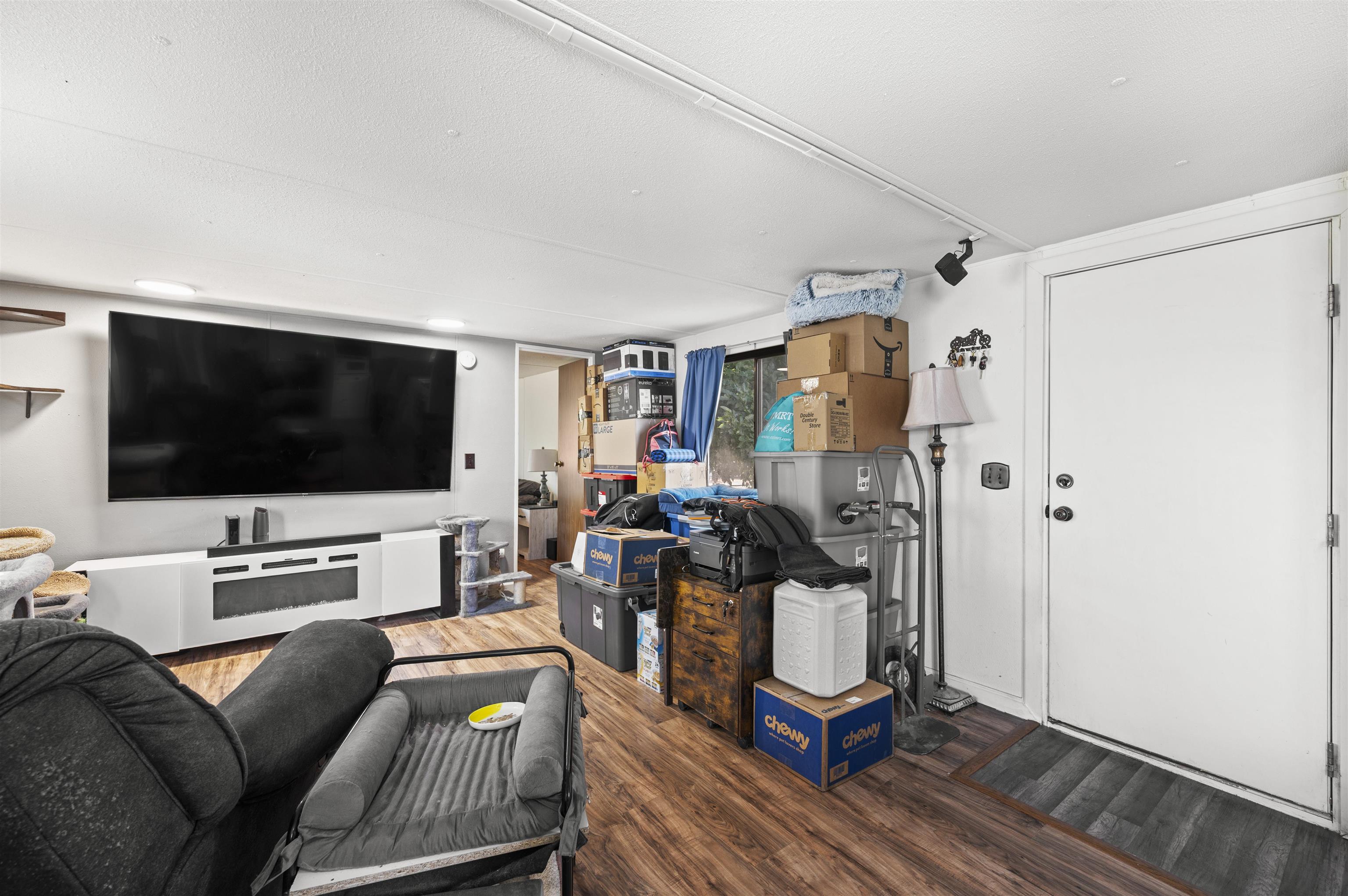 424 32 Road, Unit 6 Clifton, CO 81520 - Photo 6 of 16 a living room with furniture and a flat screen tv