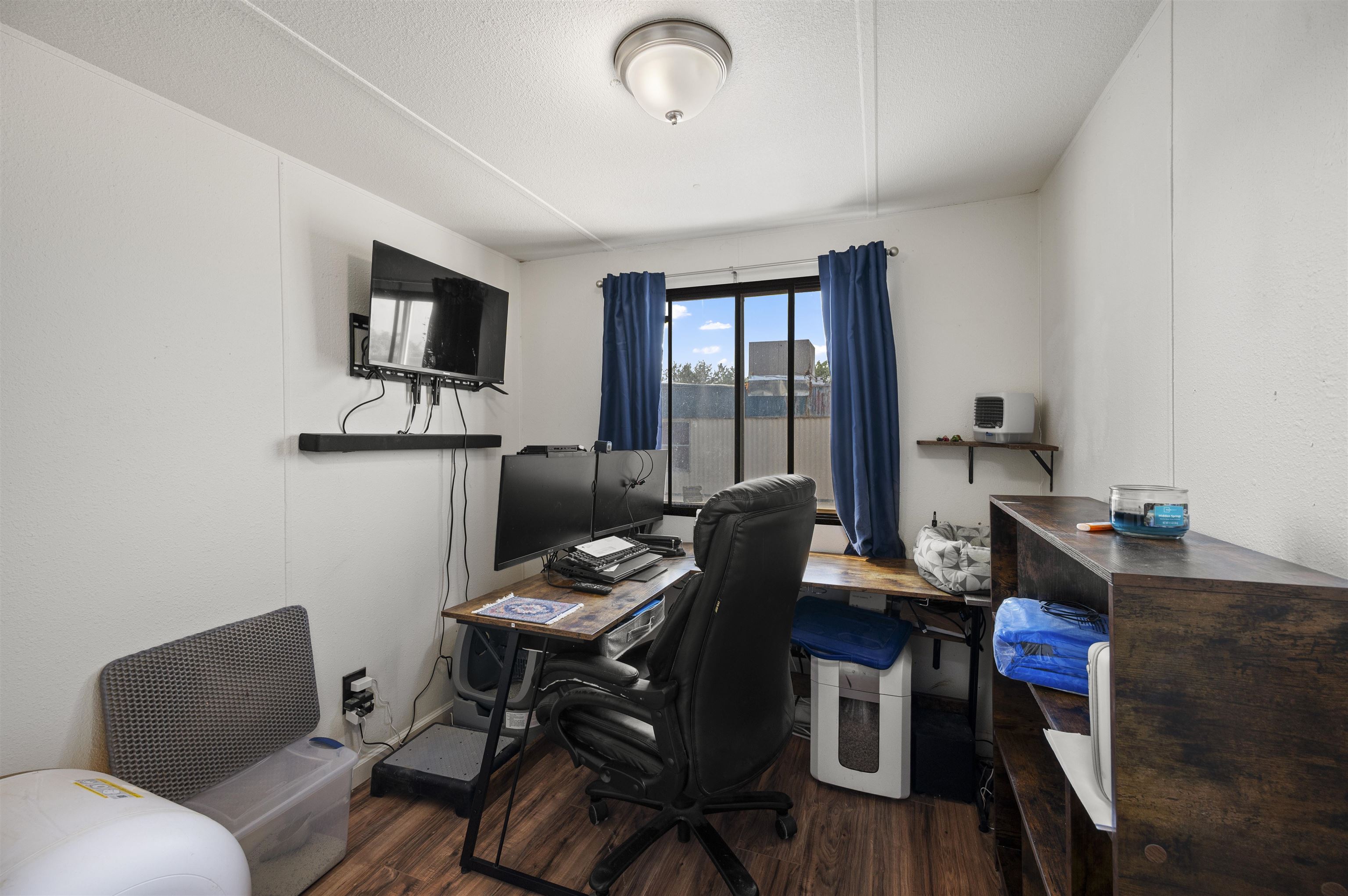 424 32 Road, Unit 6 Clifton, CO 81520 - Photo 10 of 16 a work room with furniture and wooden floor