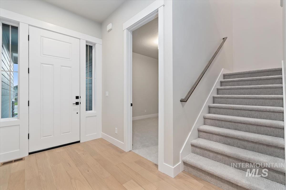 2147 East Blakehurst Avenue Kuna, ID 83634 - Photo 31 of 43 Entrance foyer with stairway and light wood finished floors