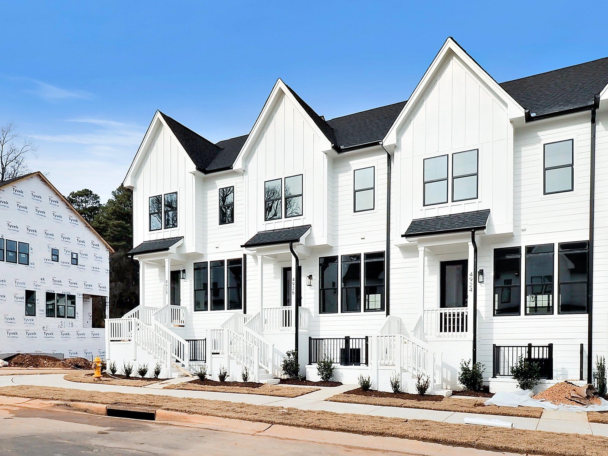 4926 Trek Lane Raleigh, NC 27606 - Photo 3 of 24 a view of a white building among the street