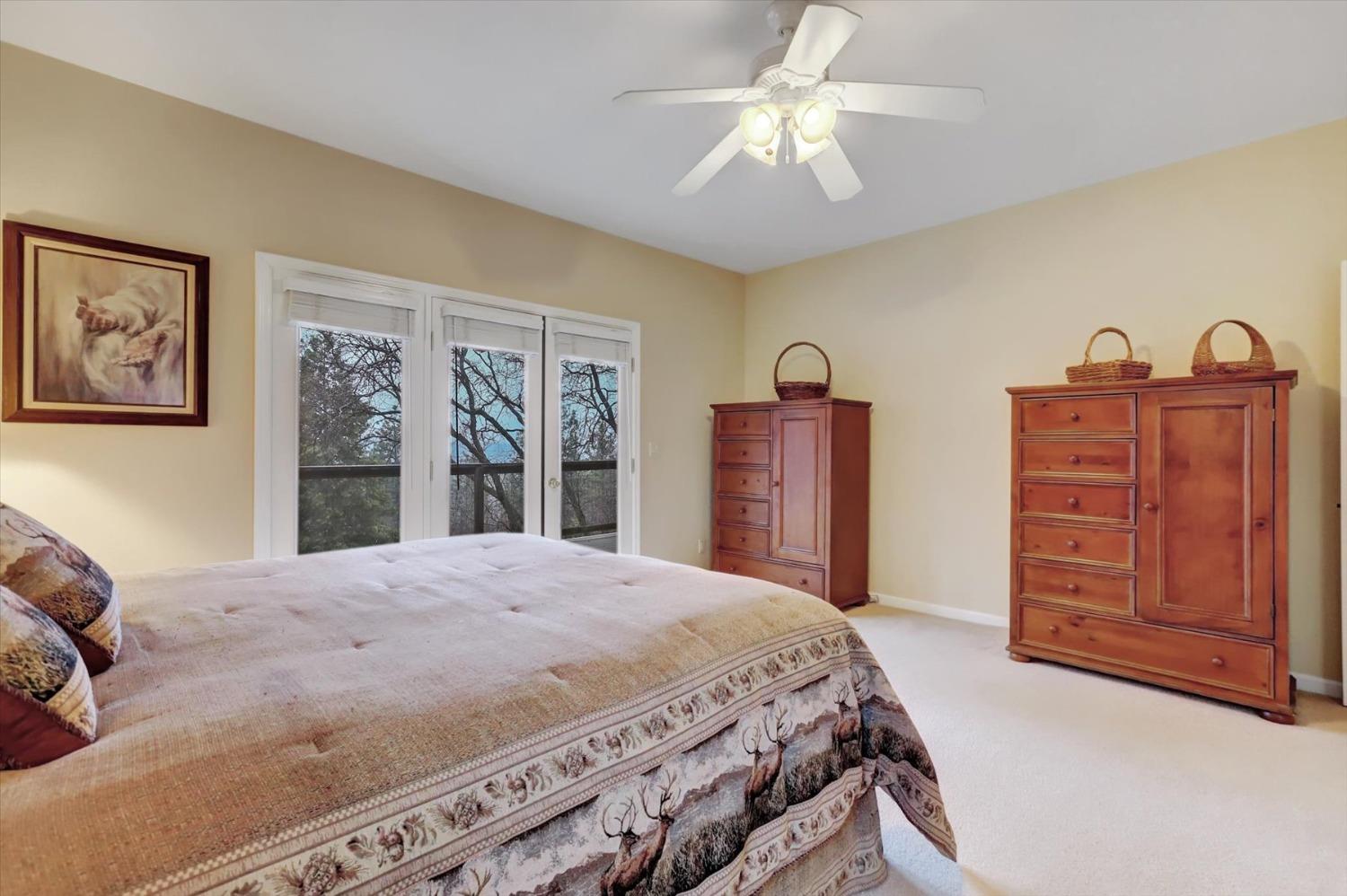 17036 Alice Way Grass Valley, CA 95949 - Photo 36 of 58 a bedroom with a bed dresser and a window