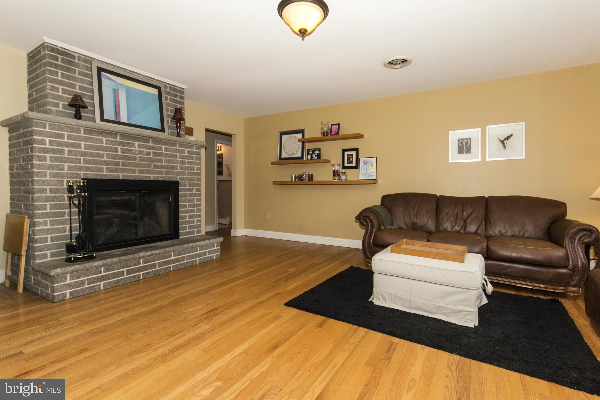 5024 Kemp Road Reisterstown, MD 21136 - Photo 1 of 30 a living room with furniture and a fireplace