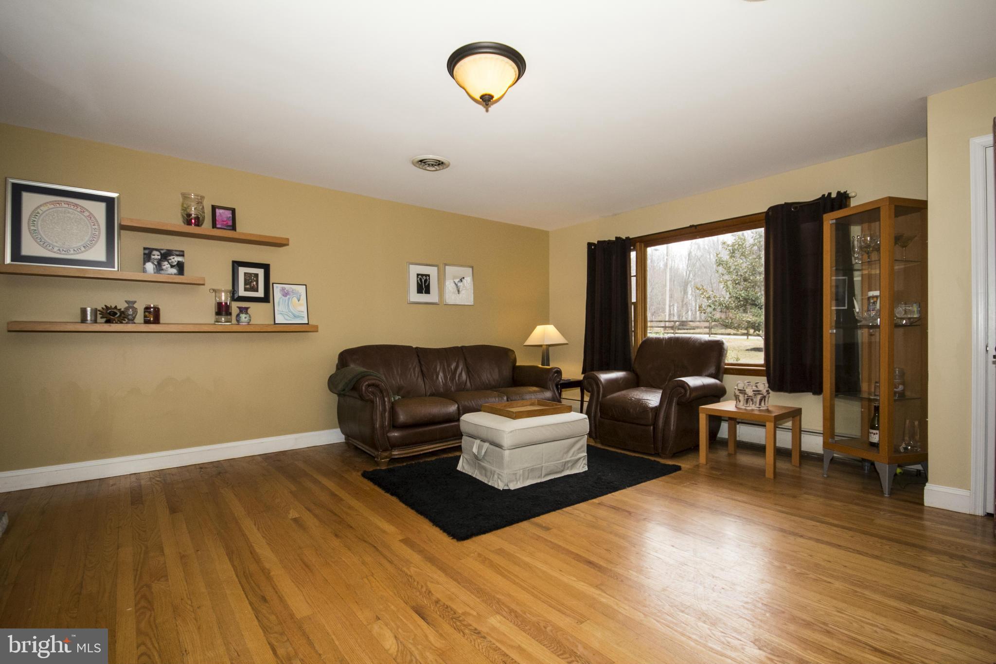5024 Kemp Road Reisterstown, MD 21136 - Photo 2 of 30 a living room with furniture window and wooden floor