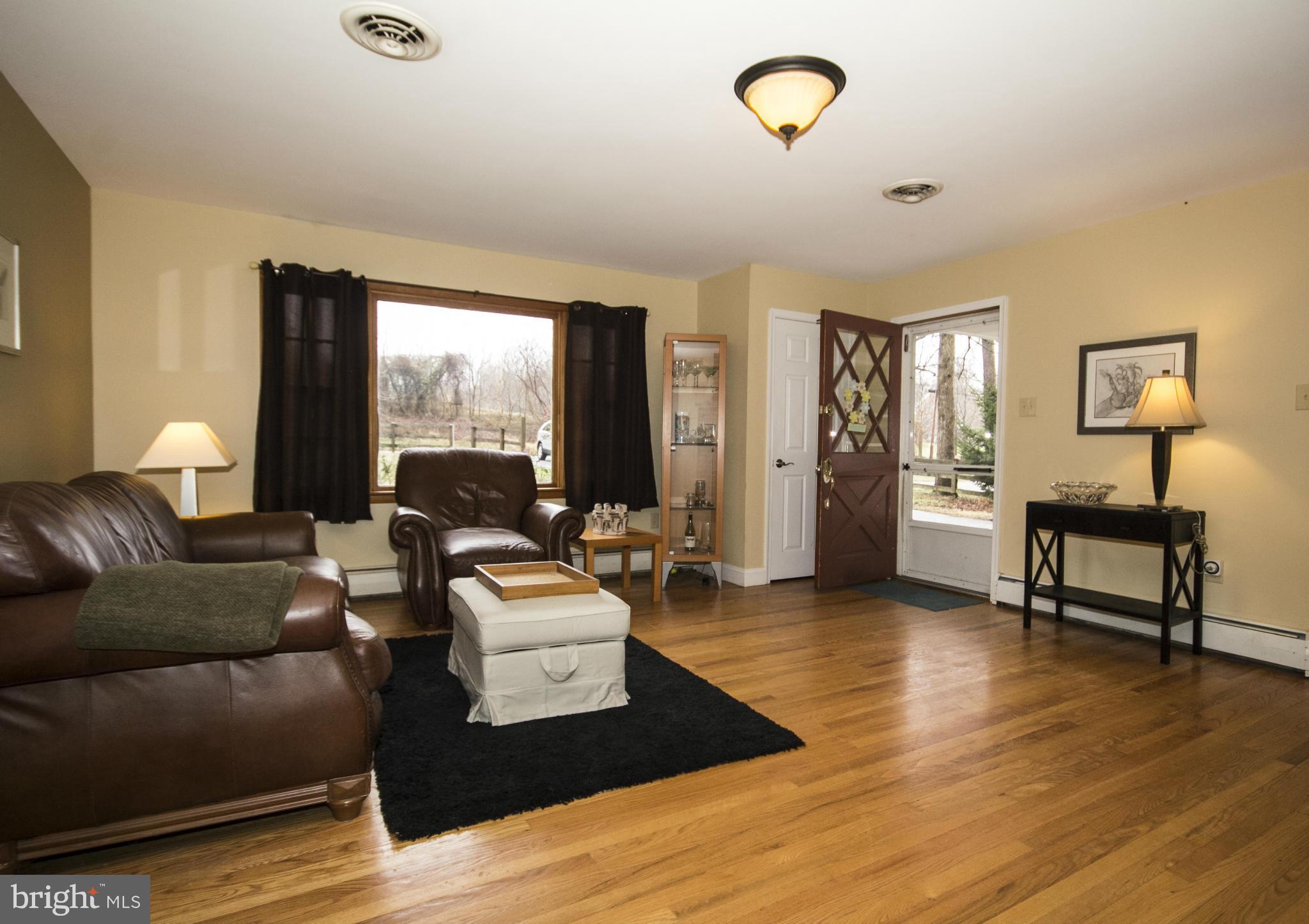 5024 Kemp Road Reisterstown, MD 21136 - Photo 3 of 30 a living room with furniture and a wooden floor