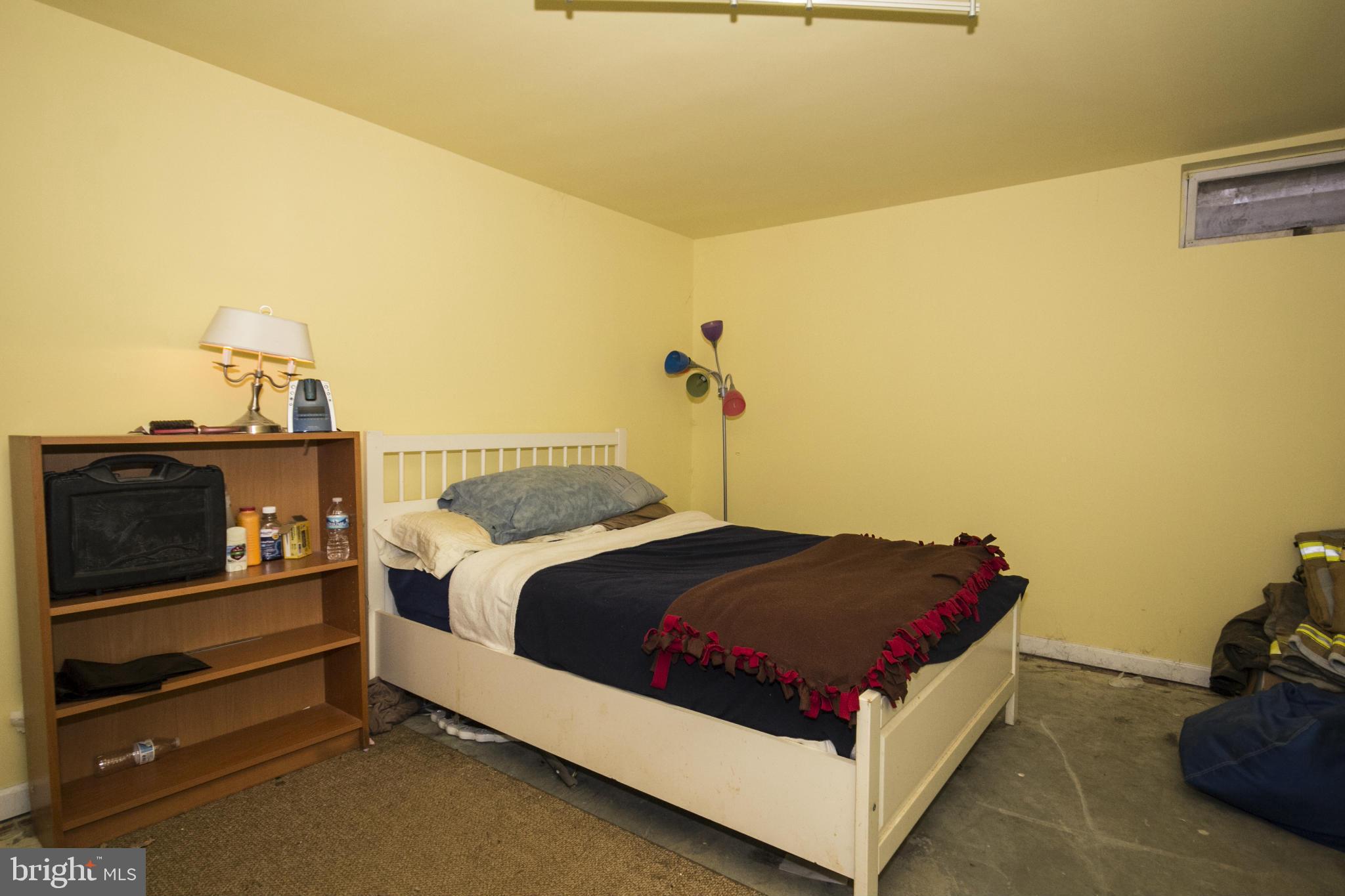 5024 Kemp Road Reisterstown, MD 21136 - Photo 24 of 30 a bedroom with a bed and a night stand