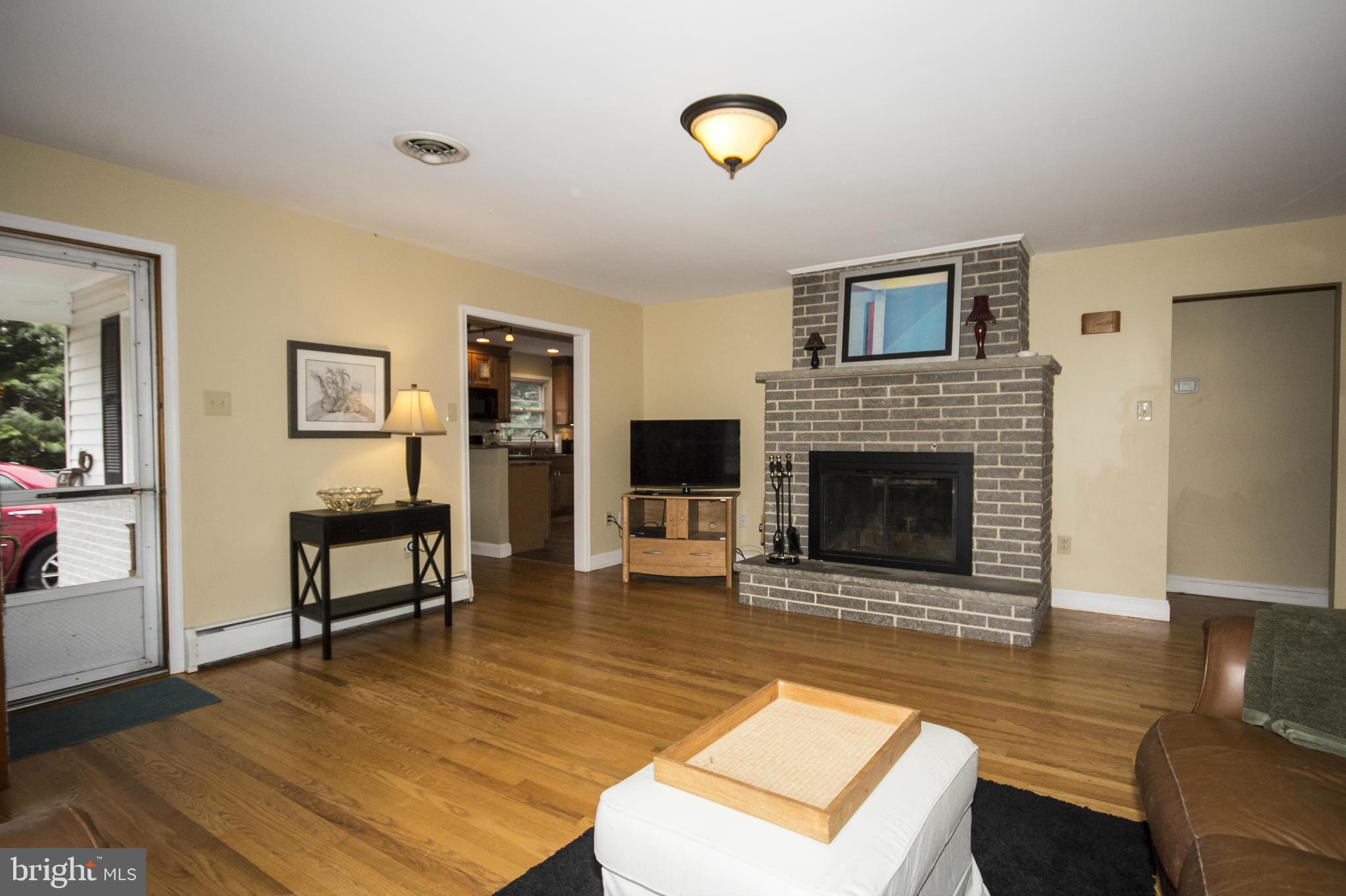 5024 Kemp Road Reisterstown, MD 21136 - Photo 4 of 30 a living room with furniture and a fireplace