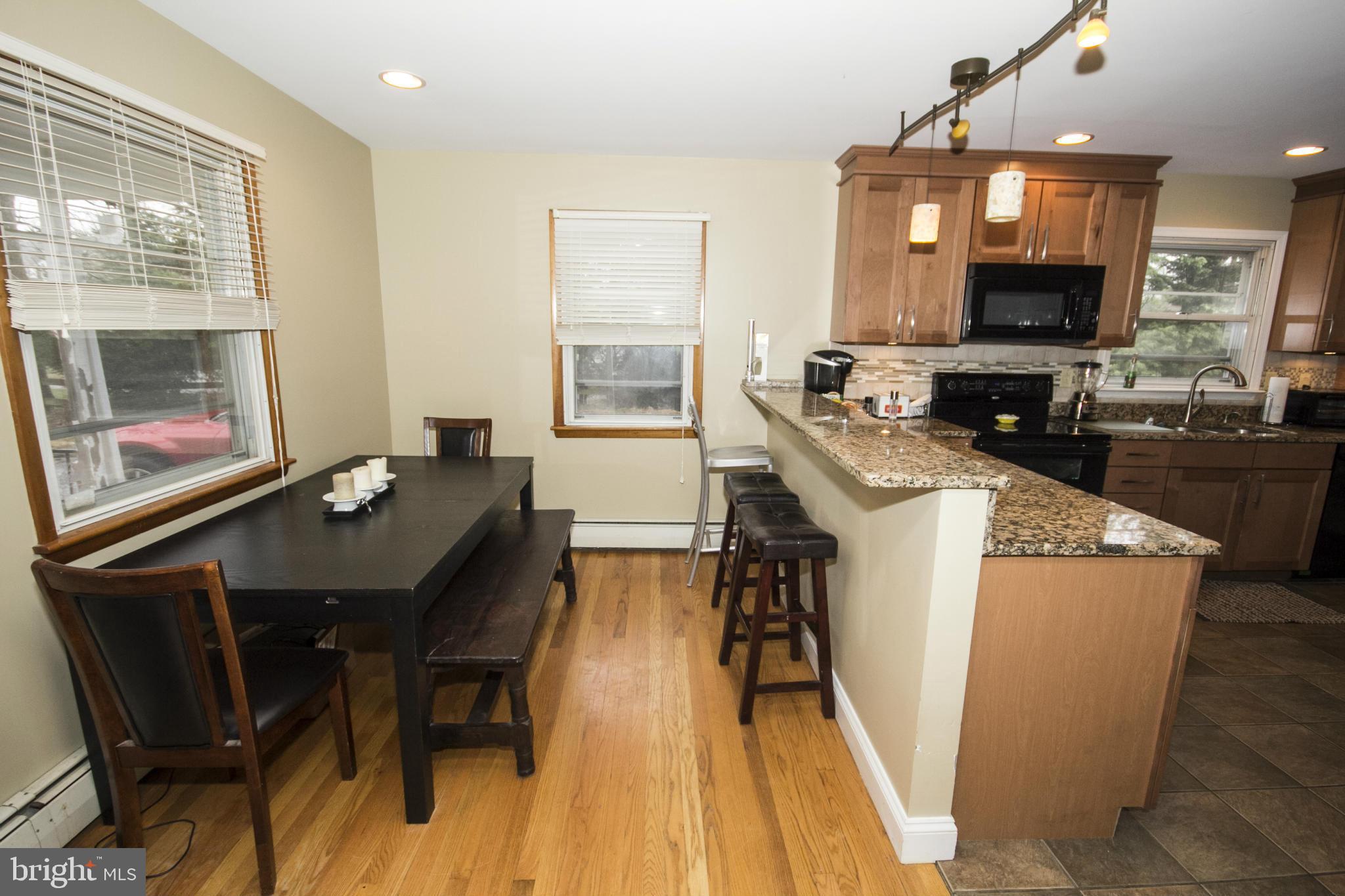 5024 Kemp Road Reisterstown, MD 21136 - Photo 6 of 30 a dining room with furniture and wooden floor