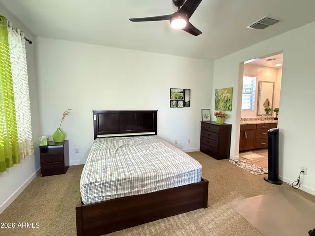 a bedroom with a bed and window