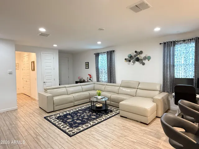 a living room with furniture and a couch