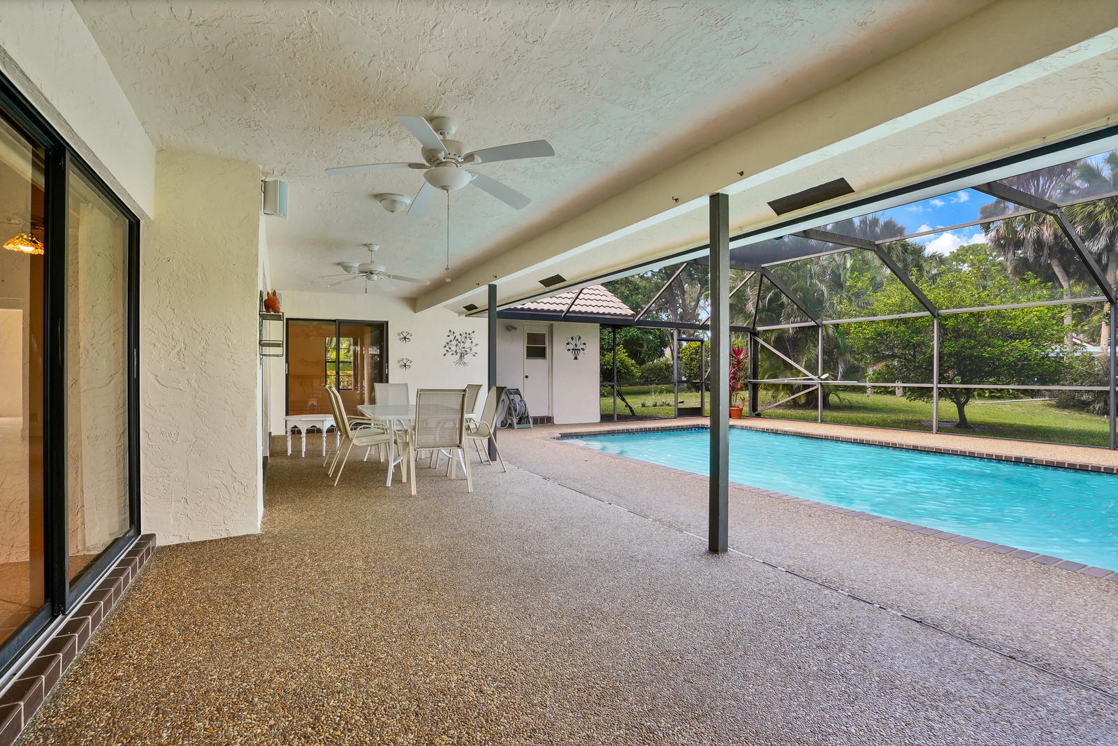 2391 Northwest 38th Street Boca Raton, FL 33431 - Photo 25 of 47 23 POOL AND PATIO AREA WITH LARGE OVERHA