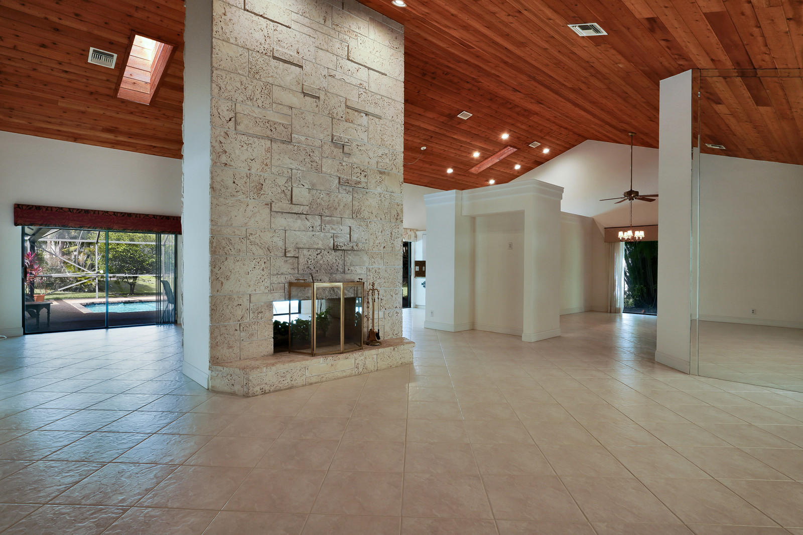 2391 Northwest 38th Street Boca Raton, FL 33431 - Photo 5 of 47 LIVING ROOM VIEW TO POOL WITH CENTER