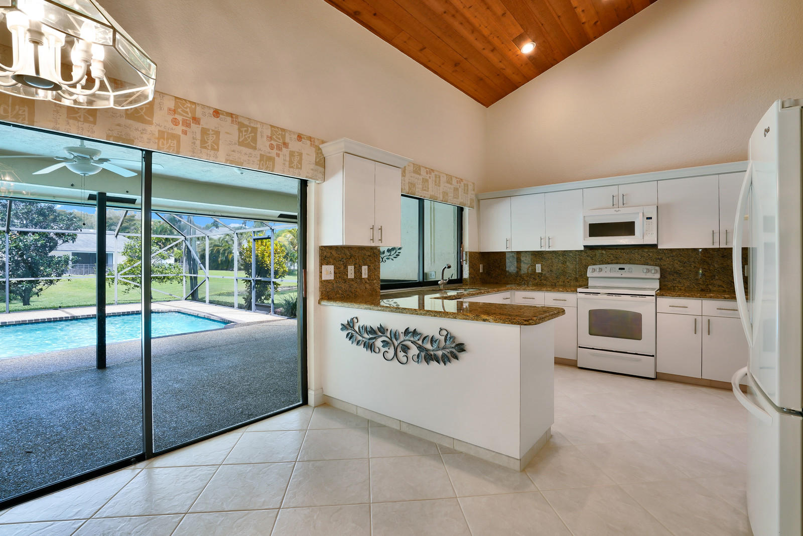 2391 Northwest 38th Street Boca Raton, FL 33431 - Photo 8 of 47 KITCHEN AND POOL VIEW