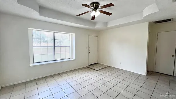 a view of an empty room and window