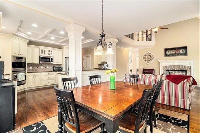 a kitchen with stainless steel appliances granite countertop a stove and cabinets