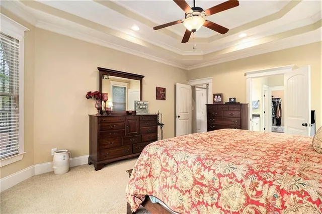 a en suite spacious bathroom with a tub shower and window