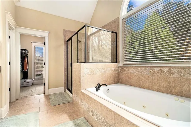 a bathroom with a double vanity sink and mirror